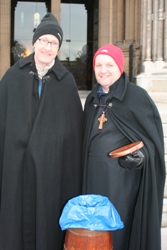 The Bishop of Connor, the Rt Rev Alan Abernethy (right) and Canon Tim Kinahan, rector of Helen's Bay, Down and Dromore Diocese, don the Black Santa cloaks on the Cathedral steps.